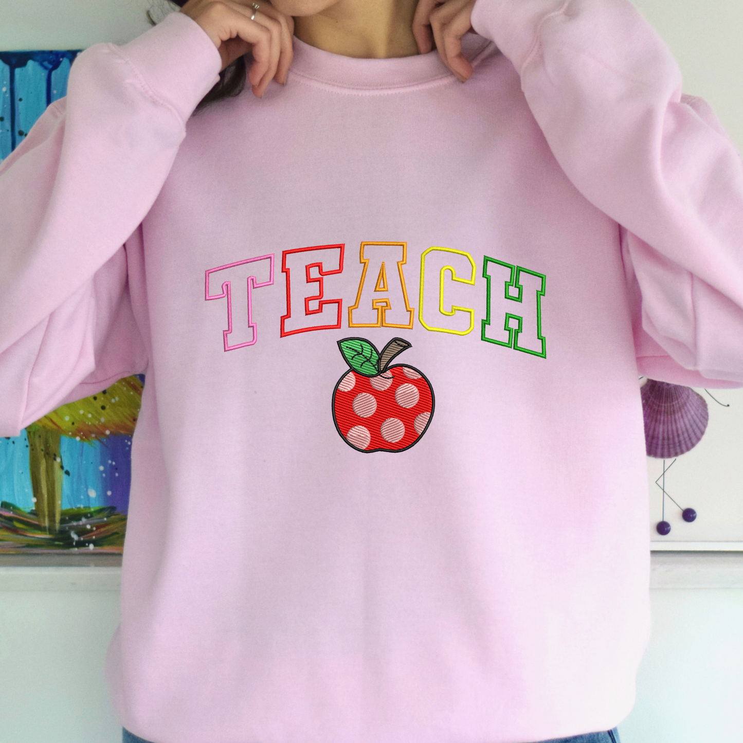 Teach Rainbow Varsity Sweatshirt